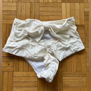 pearl white with bow tie ..unknown brand got from the internet worn once